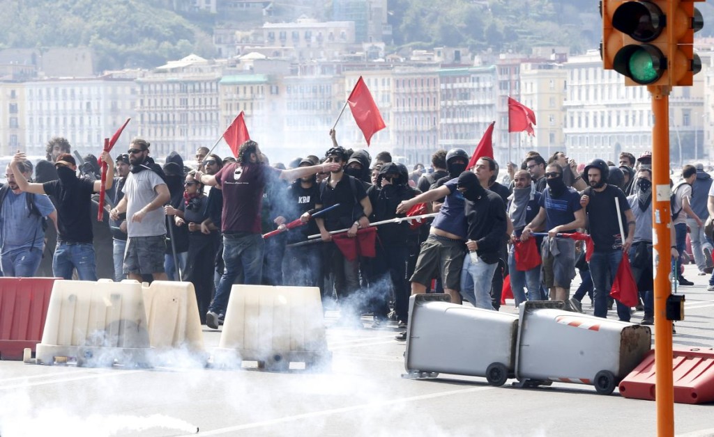 Demonstrators are seen during a protest against Prime Minister Matteo Renzi during a visit to the southern city of Naples, Italy, April 6, 2016. REUTERS/Ciro De Luca