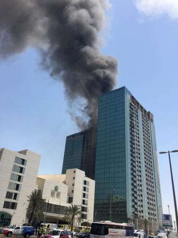Smoke rises after a fire broke out in a building at Al Maryah Island in Abu Dhabi, UAE, August 30, 2016. REUTERS/Stanley Carvalho