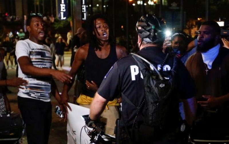 People shout at the police in uptown Charlotte, NC during a protest of the police shooting of Keith Scott, in Charlotte, North Carolina, U.S. September 21, 2016. REUTERS/Jason Miczek