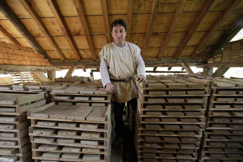 Tiler Bruno Feval poses in his workshop at the construction site of the Chateau de Guedelon. REUTERS/Jacky Naegelen