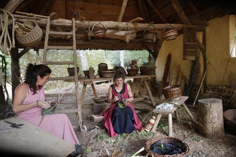 Women work at the construction site of the Chateau de Guedelon. REUTERS/Jacky Naegelen