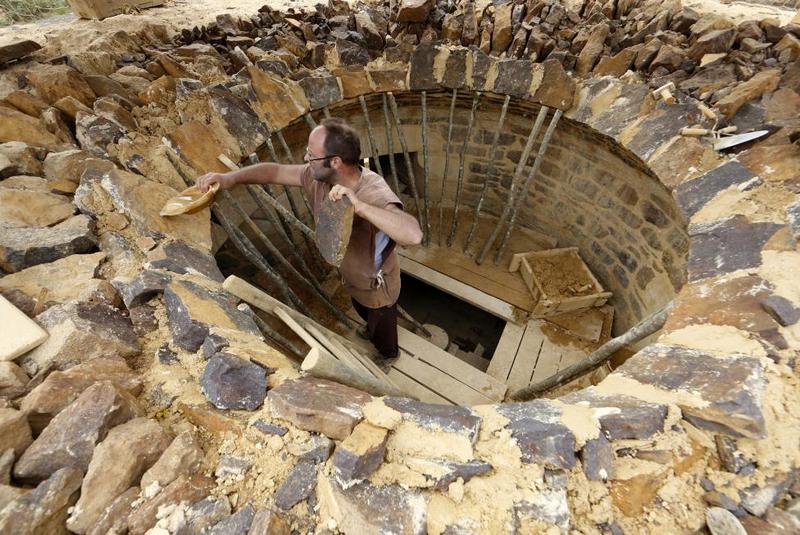 A man works at the construction site of the Chateau de Guedelon. REUTERS/Jacky Naegelen