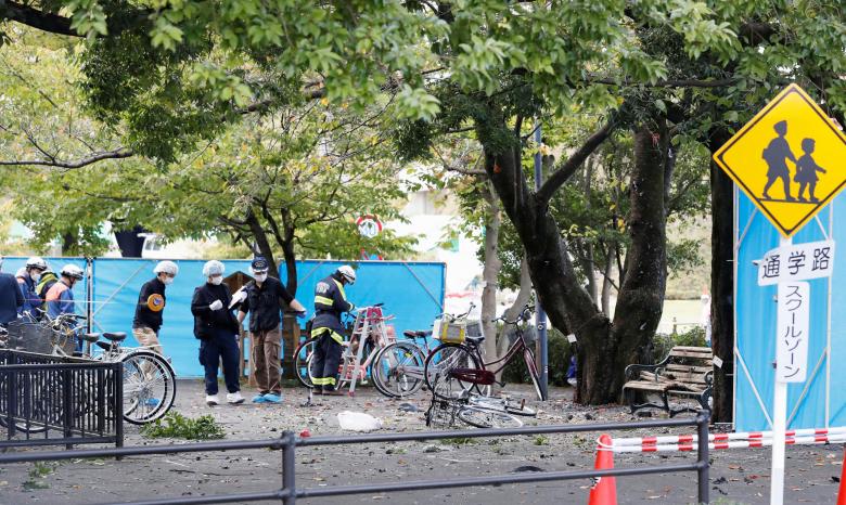 Police officers and firefighters investigate at an explosion site in Utsunomiya, Japan, in this photo taken by Kyodo October 23, 2016. Mandatory credit Kyodo/via REUTERS