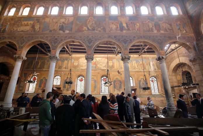 Egyptian security officials and investigators inspect the scene following a bombing inside Cairo's Coptic cathedral in Egypt December 11, 2016. REUTERS/Amr Abdallah Dalsh