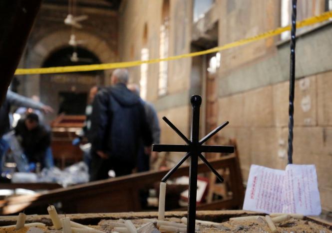 Egyptian security officials and investigators inspect the scene following a bombing inside Cairo's Coptic cathedral in Egypt December 11, 2016. REUTERS/Amr Abdallah Dalsh