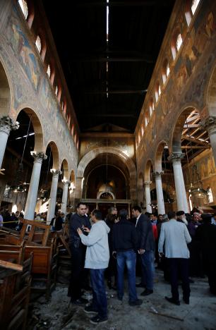 Egyptian security officials and investigators inspect the scene following a bombing inside Cairo's Coptic cathedral in Egypt December 11, 2016. REUTERS/Amr Abdallah Dalsh