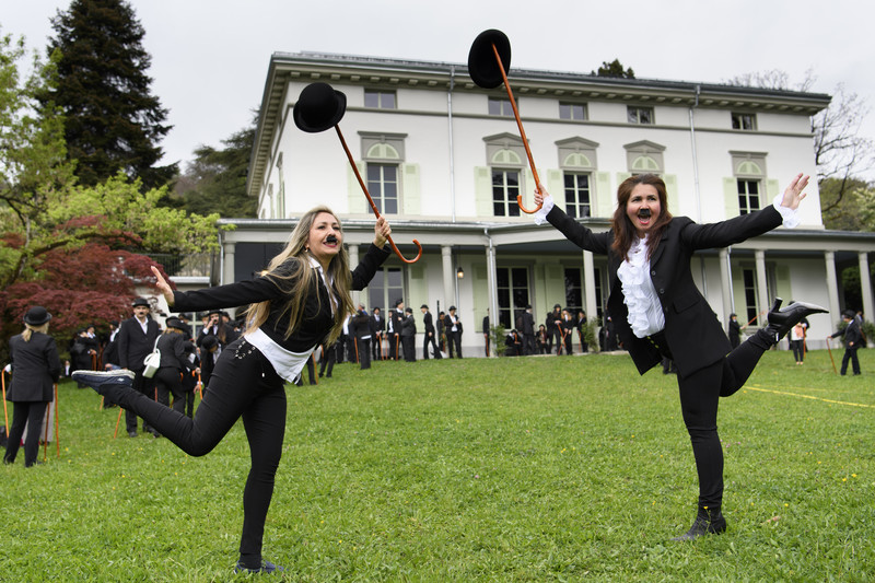 epa05910684 Some 662 people dressed as Charlie Chaplin pose for a group photo in front of the Manoir de Ban during an attempt of the world's largest gathering of people dressed as 'The Tramp' on the occasion of Charlie Chaplin's birthday, and to celebrate the first year of the museum "Chaplin's World by Grevin", in Corsier, above Vevey, Switzerland, 16 April 2017. Chaplin's World, a museum on English comic actor, filmmaker, and composer Charlie Chaplin, is located in a 14 hectare park of lush trees, it occupies the mansion where the Chaplin family lived the last 25 years of Charly Chaplin's life. EPA/LAURENT GILLIERON