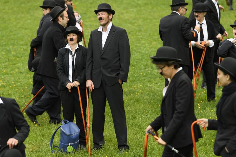 epa05910540 662 peoples dressed in Charlie Chaplin pose for a group photo in front of the Manoir de Ban during an attempt of the world's largest gathering of people dressed as The Tramp on the occasion of Charlie Chaplin's birthday, and to celebrate the first year of the museum "Chaplin's World by Grevin", in Corsier, above Vevey, Switzerland, 16 April 2017. Chaplin's World, a museum on English comic actor, filmmaker, and composer Charlie Chaplin, is located in a 14 hectare park of lush trees, it occupies the mansion where the Chaplin family lived the last 25 years of Charly Chaplin's life. EPA/LAURENT GILLIERON