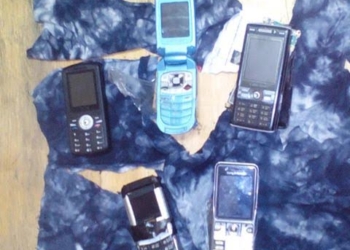 Через забор Ольшанской ИК пытались перебросить пять мобильных телефонов