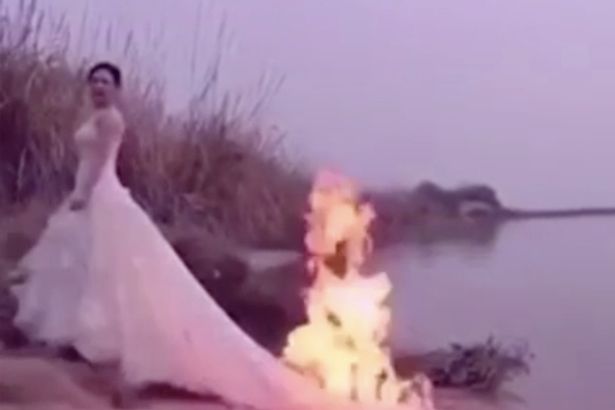Ради эффектных фото: китайская невеста решила поджечь подвенечное платье 1