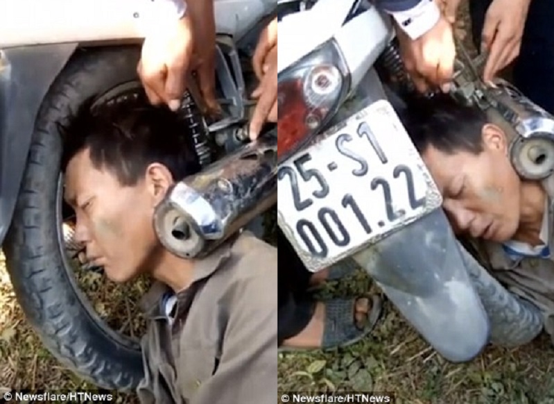 Пьяный вьетнамец умудрился засунуть голову между выхлопной трубой и колесом мотоцикла 1