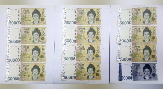 Кореянка случайно разрезала в шредере 550 тысяч вон и склеивала купюры целый месяц