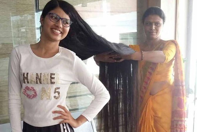 Обиделась на парикмахеров: индийская девушка обновила рекорд по длине волос (ФОТО) 3