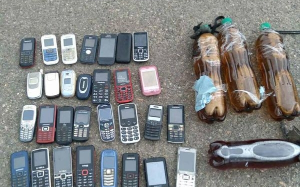 В Арбузинскую колонию пытались перебросить спиртное и мобилки (ФОТО)