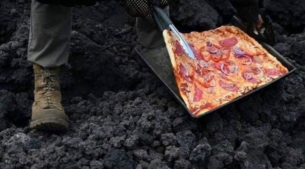 Настоящий туристический магнит: гватемалец печет пиццу на расплавленной лаве действующего вулкана (ВИДЕО) 1