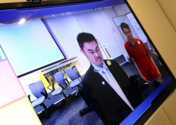 Canon установил в своих офисах в Китае камеры, которые пропускают только улыбающихся сотрудников