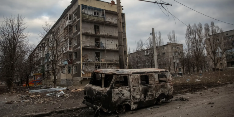 A general view shows an empty street and buildings damaged by a Russian military strike in Bakhmut